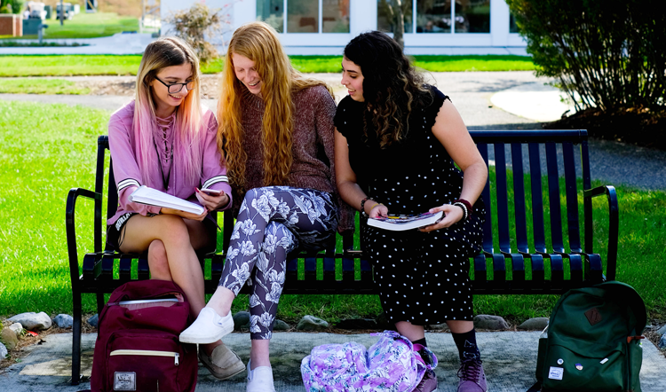 xt23z.com three female students studying on a bench on camp at Ocean County College